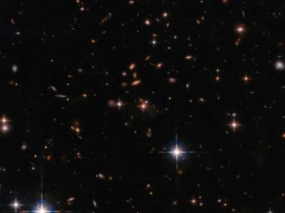 کشف جدید جیمز وب/ یک خوشه کهکشانی شگفت‌انگیز در کیهان اولیه